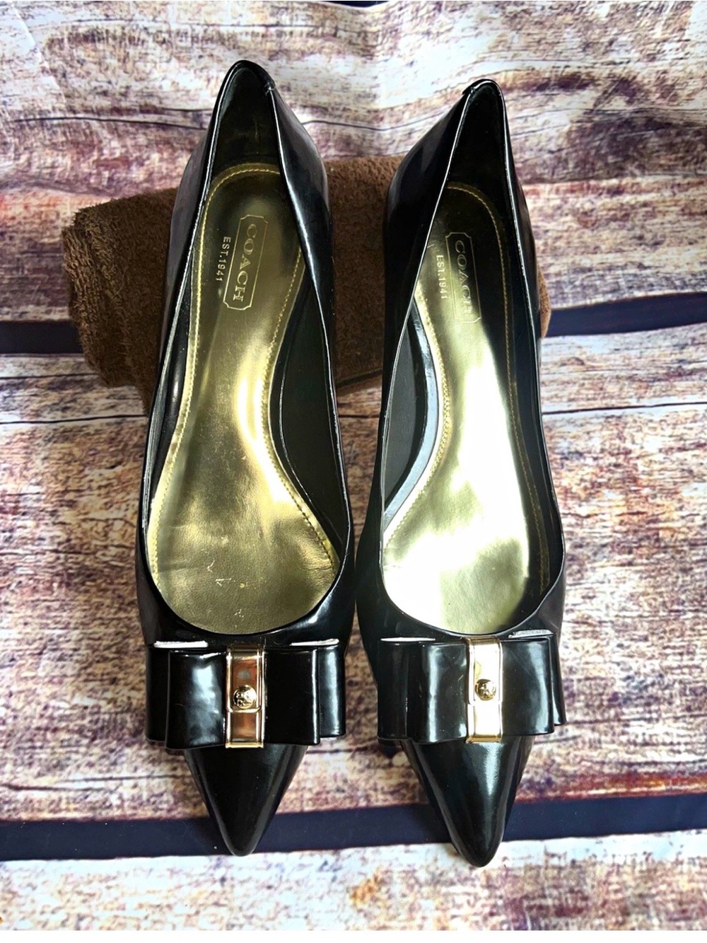 Coach Black Patent Pointed Toe Pumps with Bow and Gold Accent